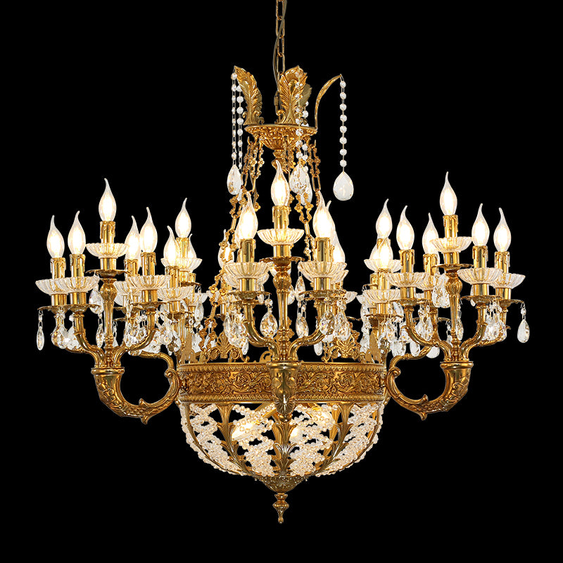 A villa chandelier installed in a grand residential lobby with double-height ceilings and a sweeping marble staircase.