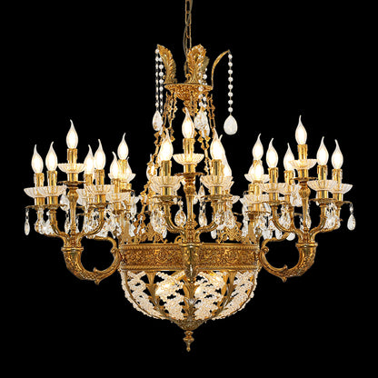A villa chandelier installed in a grand residential lobby with double-height ceilings and a sweeping marble staircase.