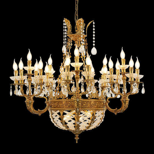 A villa chandelier installed in a grand residential lobby with double-height ceilings and a sweeping marble staircase.