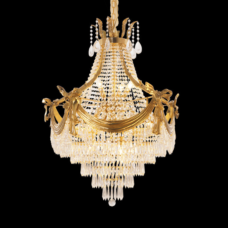 JEWELLERY TOP brand's crystal staircase chandelier featuring a central Psyche sculpture and golden accents.