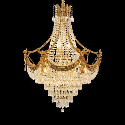 A large size luxury chandelier installed in a grand villa lobby with marble walls and a high ceiling.