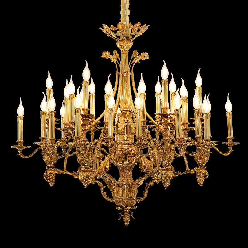 Close-up detail of a luxurious Bourbon Baroque brass chandelier with intricate carvings and candle bulbs.