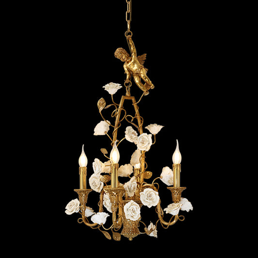 Full-length studio shot of the French Rococo Cherub & Porcelain Rose Bouquet brass chandelier glowing against a dark background.