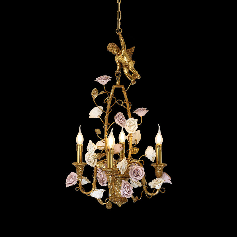 A luxury ceramic flower chandelier installed in an elegant residential dining room with classic French wall moldings.
