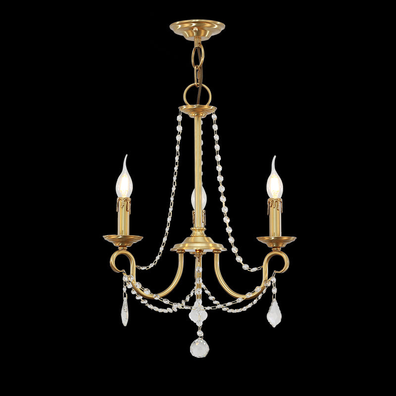 Bijou de Lumière Petite Brass Chandelier with crystal bead strands hanging against a black background.