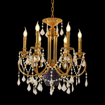 A french chandelier installed in a luxurious boutique hotel lobby with ornate wall sconces and a grand mirror.