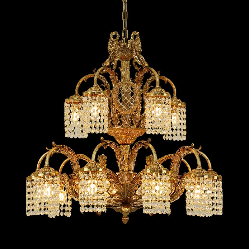 Full studio shot of the French Rococo Revival style solid brass chandelier glowing against a stark black background.