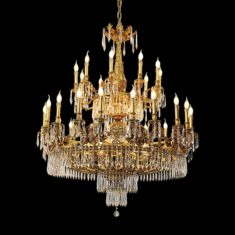 Close-up detail of a classic French brass chandelier's intricate metalwork and candle-style lights.