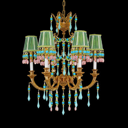 A vintage brass chandelier with multi-colored fabric shades and crystal beads on black background.