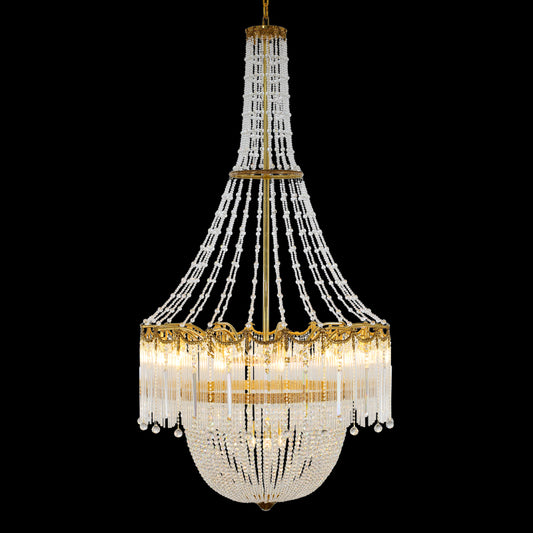 Full studio shot of the French Versailles Palace tiered crystal and brass chandelier glowing against a stark black background.