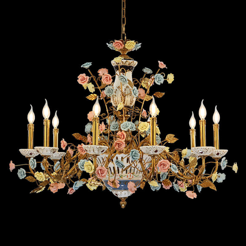 A french decorative chandelier installed in an elegant dining room with classic French wallpaper and sophisticated drapery.
