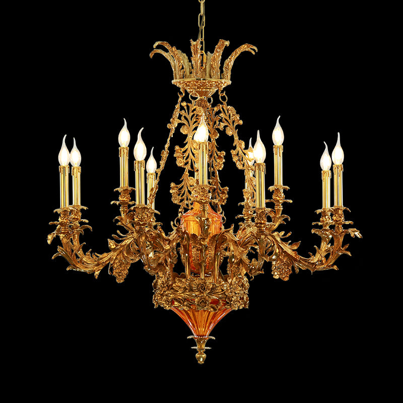 Front view of a luxury French brass chandelier with intricate floral and a central orange shade.