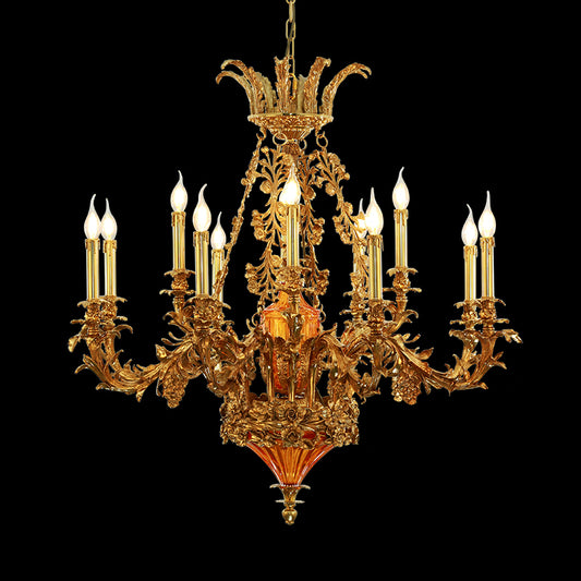 Front view of a luxury French brass chandelier with intricate floral and a central orange shade.