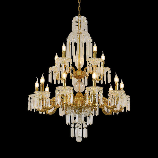 A large size decorative chandelier installed in a grand double-height entrance hall with classical wall paneling and a decorative archway.