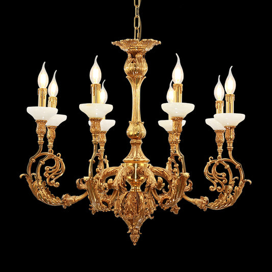 Rococo style brass chandelier with white fabric shades isolated on black background.
