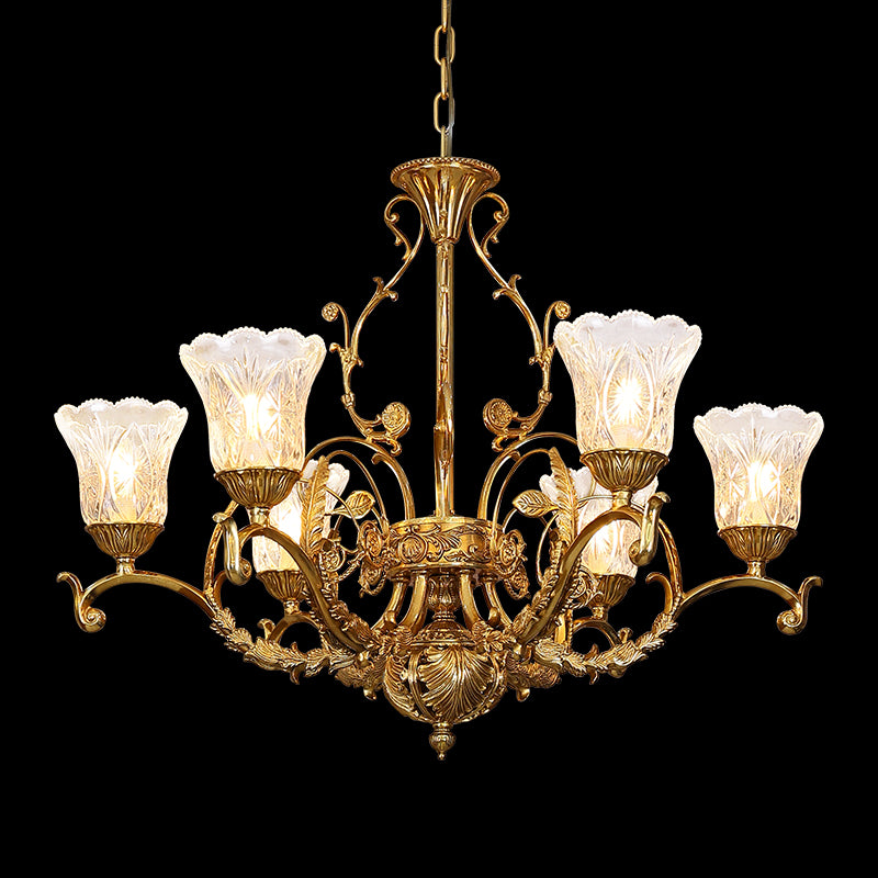 Full-length studio shot of the French Victorian Foliage & Shell Glass brass chandelier glowing against a stark black background.