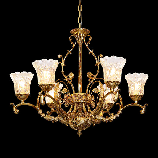 Full-length studio shot of the French Victorian Foliage & Shell Glass brass chandelier glowing against a stark black background.