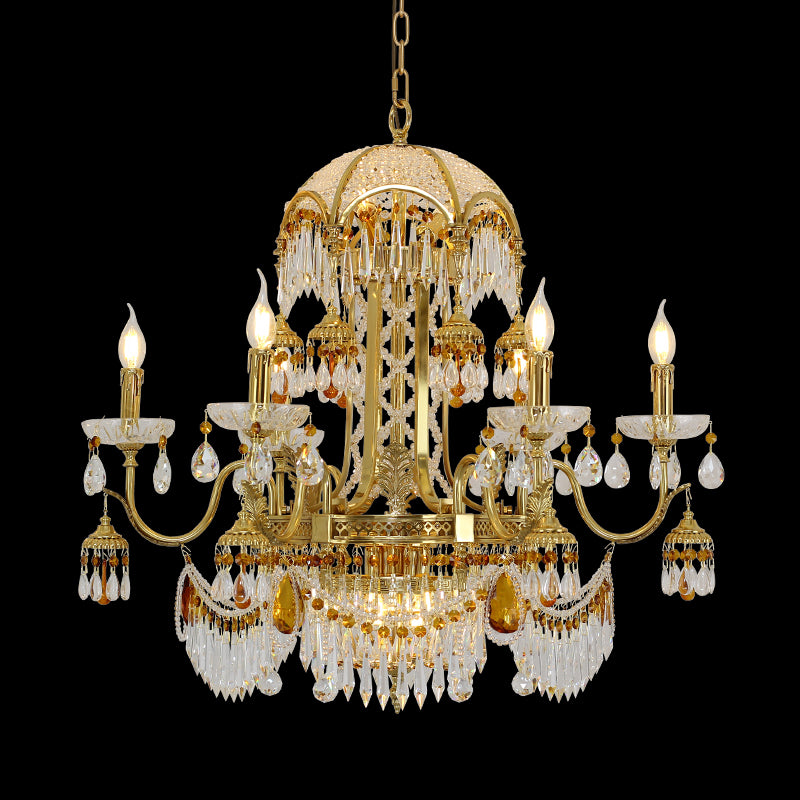 Full studio shot of the French Baroque Opulence crystal and brass chandelier glowing against a stark black background.