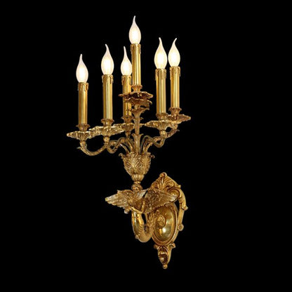 Front view of the Mythical Guardians brass wall sconce featuring a golden Pegasus sculpture and five candle lights on black.