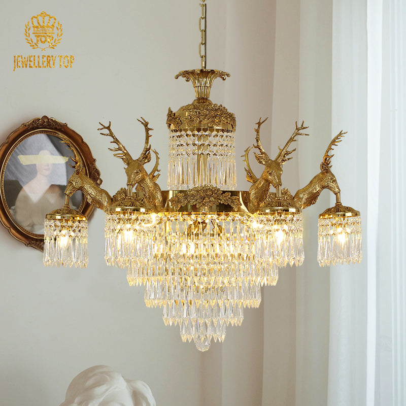 Wide angle view of the luxury crystal chandelier illuminating an elegant villa interior with classic wall moldings.