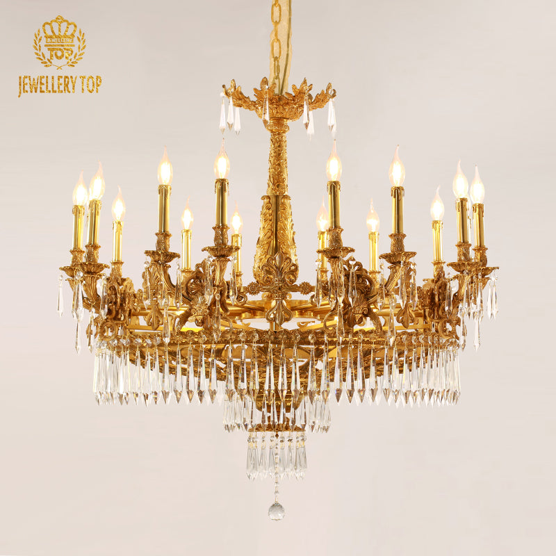 An ornate brass chandelier hanging in a high-ceilinged room, showcasing its grand scale and craftsmanship.
