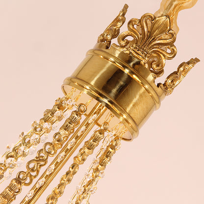 Macro close-up of the Fleur-de-lis motif and the ribbed, amber-tinted crystal elements.