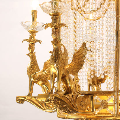Macro close-up of the finely detailed golden winged griffin sculpture wrapped with crystal beaded chains.
