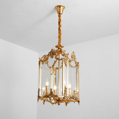 Lit classical brass pendant light mounted on a simple white ceiling, emitting a warm glow.
