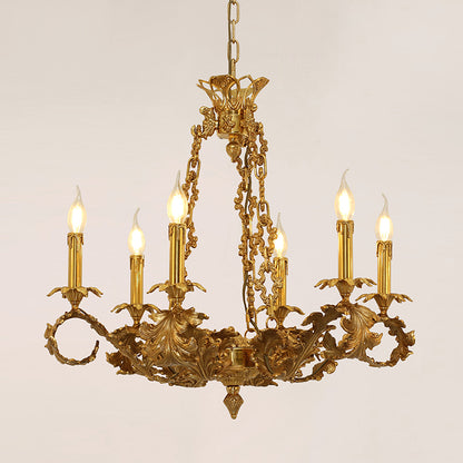 Lit French-style brass chandelier with six candle lights and ornate metalwork.