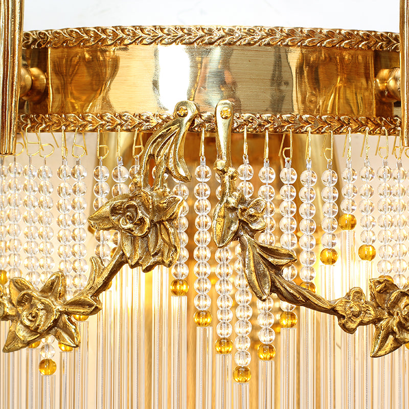 Detailed view of the cascading cylindrical crystal rods and amber bead accents on the designer sconce.