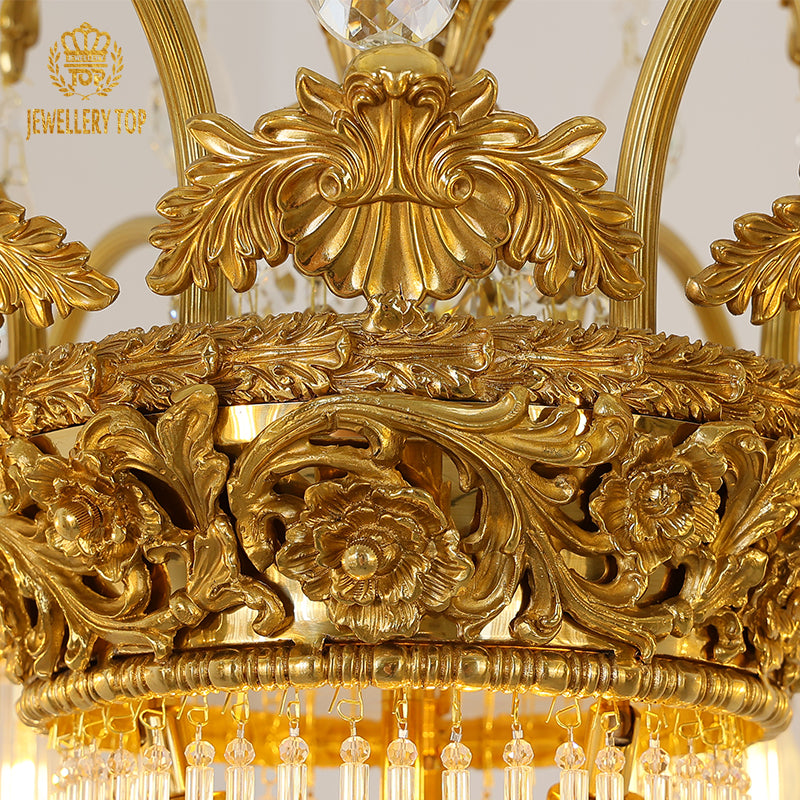 Extreme close-up of hand-chased laurel leaf and scroll details on the brass framework.