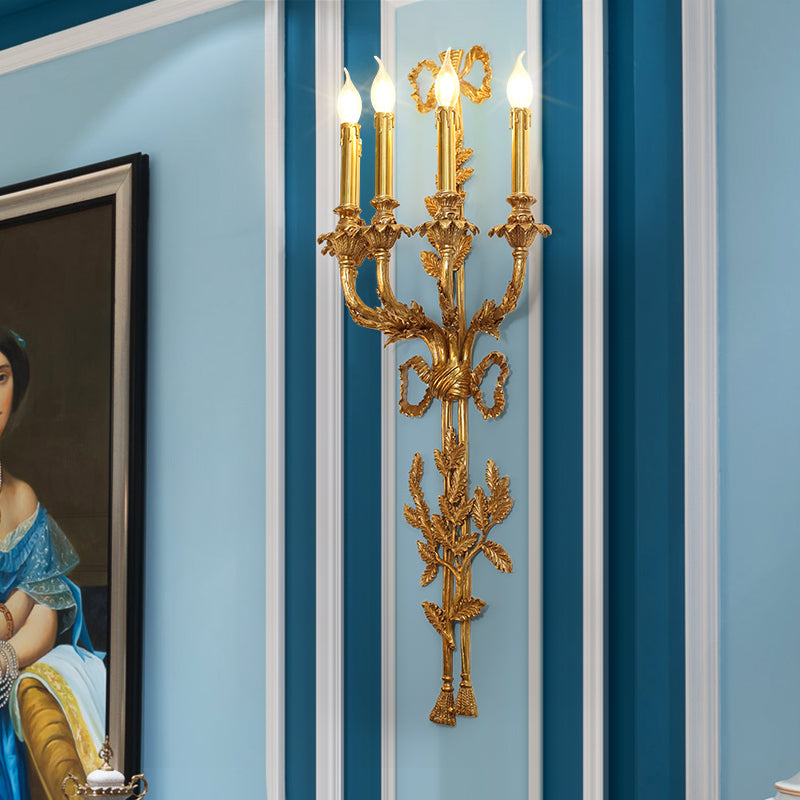 The French wall light installed on a classic blue and white wallpapered wall, illuminating a hallway with a portrait.