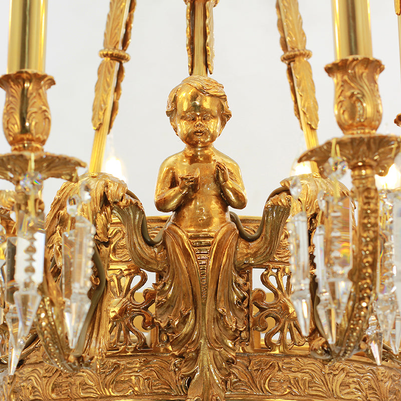 Extreme detail shot of the ornate solid brass arm with foliate carvings and crystal embellishments.