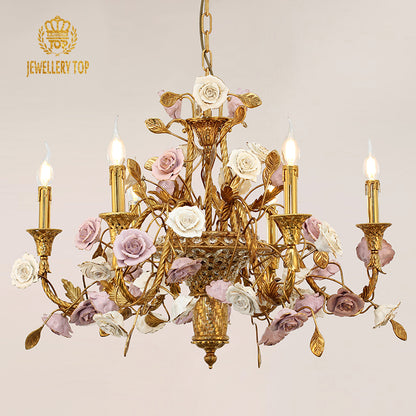 Front view of a JEWELLERY TOP brass chandelier with a central vase and ceramic rose decorations.