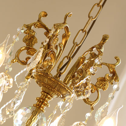 Ornate brass scrollwork and leaf detail on the French crystal chandelier.
