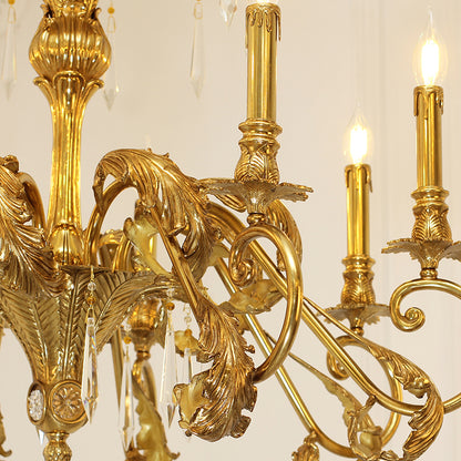 Extreme detail shot of the ornate candle sockets and the interwoven golden metalwork forming the canopy.