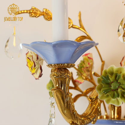 Extreme close-up of a sparkling crystal teardrop and the intricate textured surface of the ceramic vase.