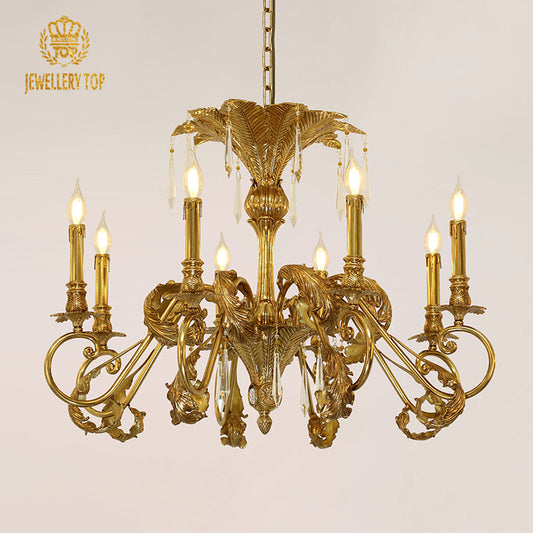 An antique chandelier installed in a grand, classically decorated living room with elaborate crown molding.