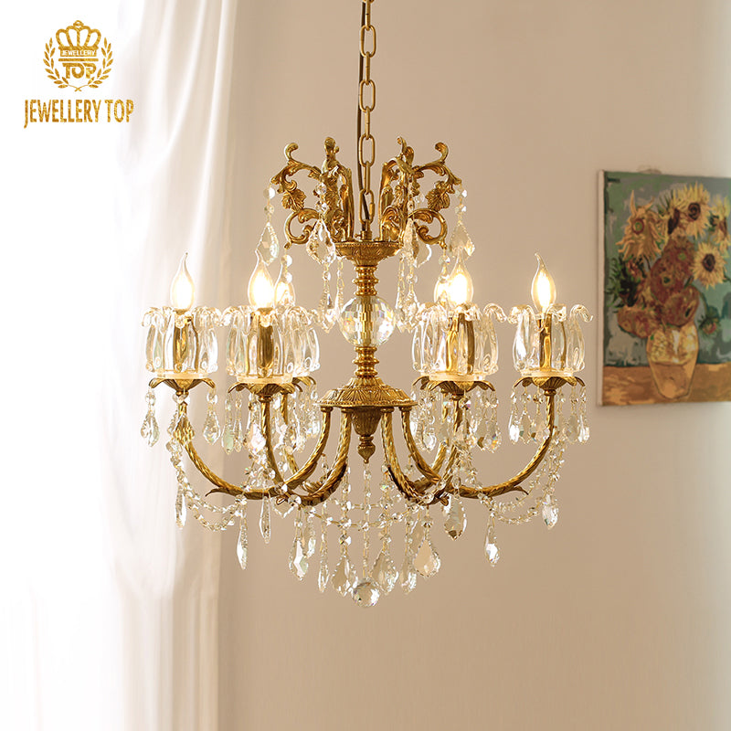 JEWELLERY TOP brass crystal chandelier in a room with white curtains and sunflower painting.