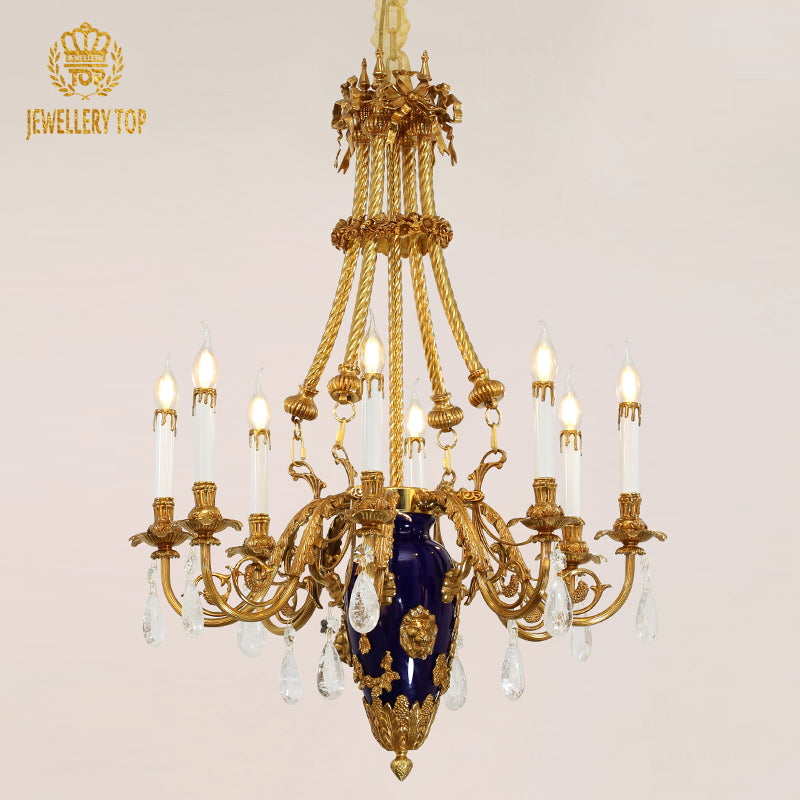 Front view of a golden French brass chandelier with a blue ceramic vase and crystal, brand visible.