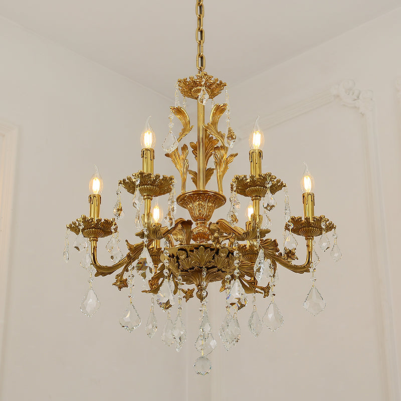 Extreme detail shot focusing on the candle-style flame bulbs and the ornate brass leaf embellishments.