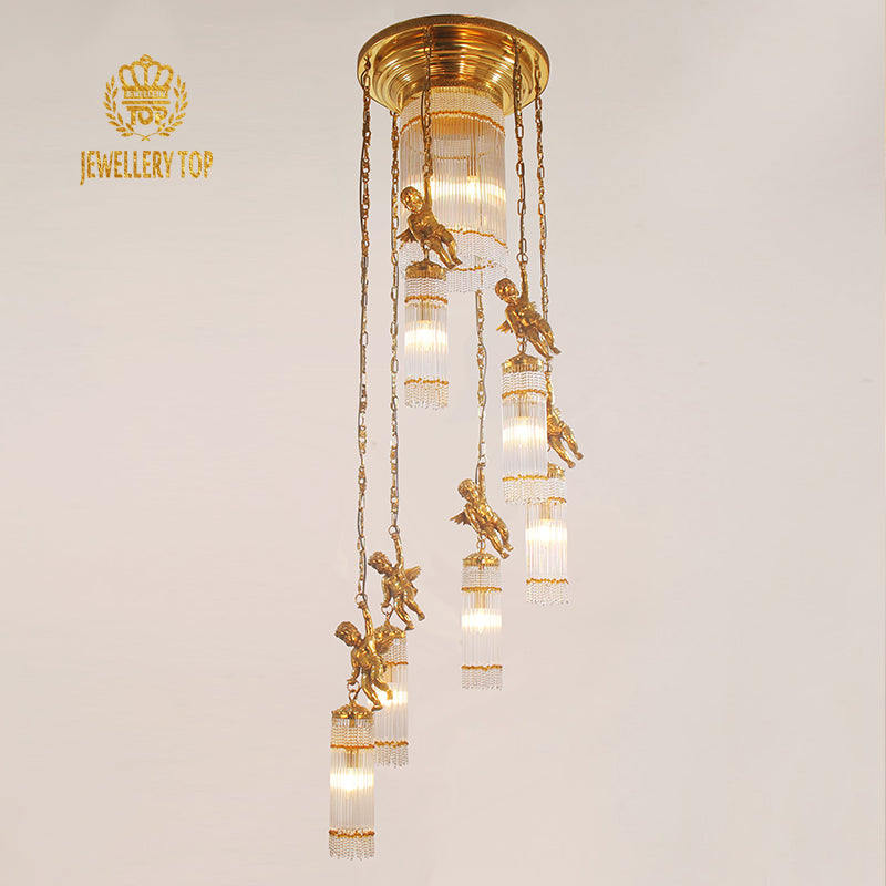 JEWELLERY TOP brand's golden brass staircase chandelier with cherub decorations against white wall.