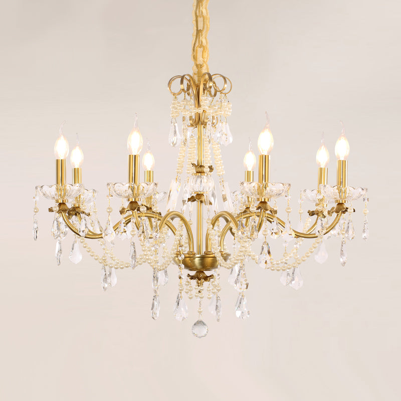 Extreme detail shot focusing on the candle-shaped filament bulbs and the decorative brass canopy at the top.