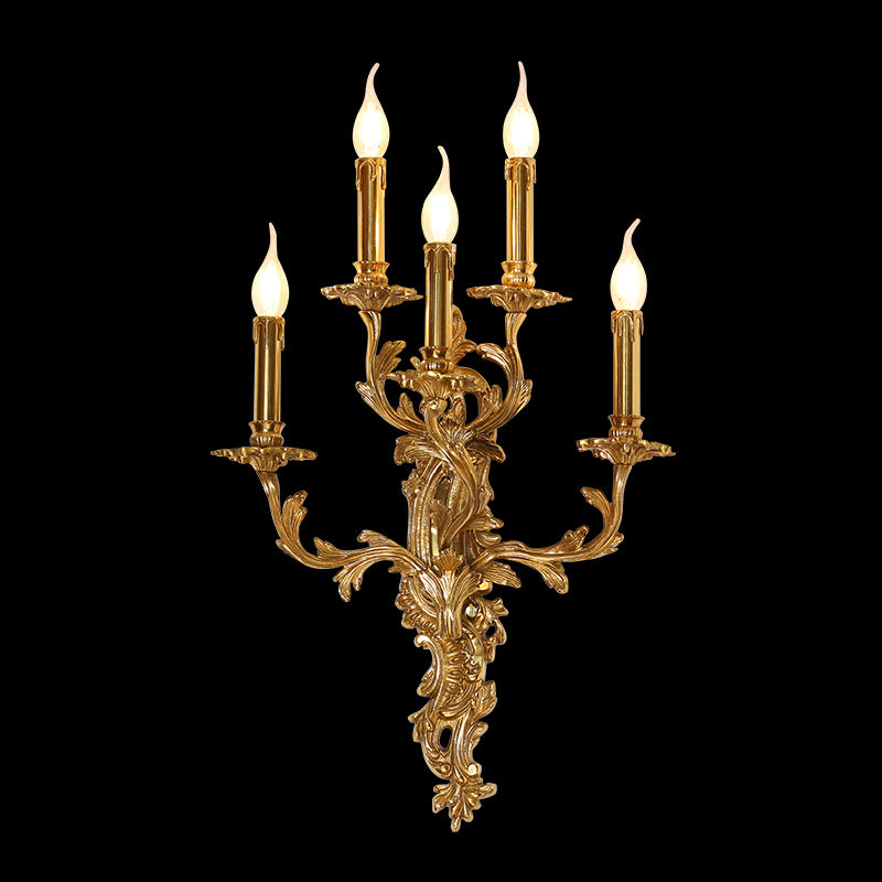 Detailed macro shot of a five-arm brass wall lamp, featuring ornate metalwork and realistic flame-tip LED candles.