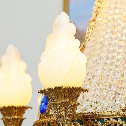 Macro close-up of the finely detailed golden acanthus leaves and the faceted blue crystal embellishments.