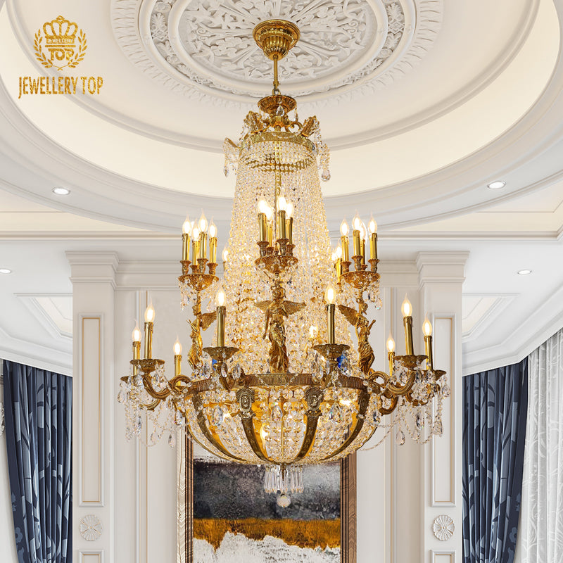 JEWELLERY TOP brand's large size brass chandelier featuring a central golden angel sculpture against a white wall.