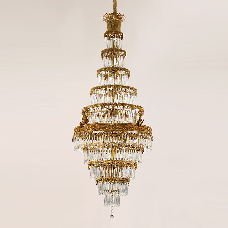 Front view of a luxury multi-level brass crystal chandelier for tall spaces.