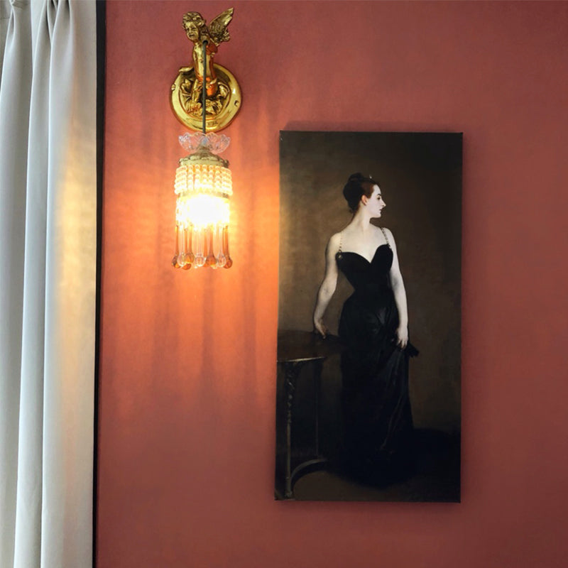 The French wall light installed on a warm orange wall beside a portrait, emitting a soft, elegant glow.