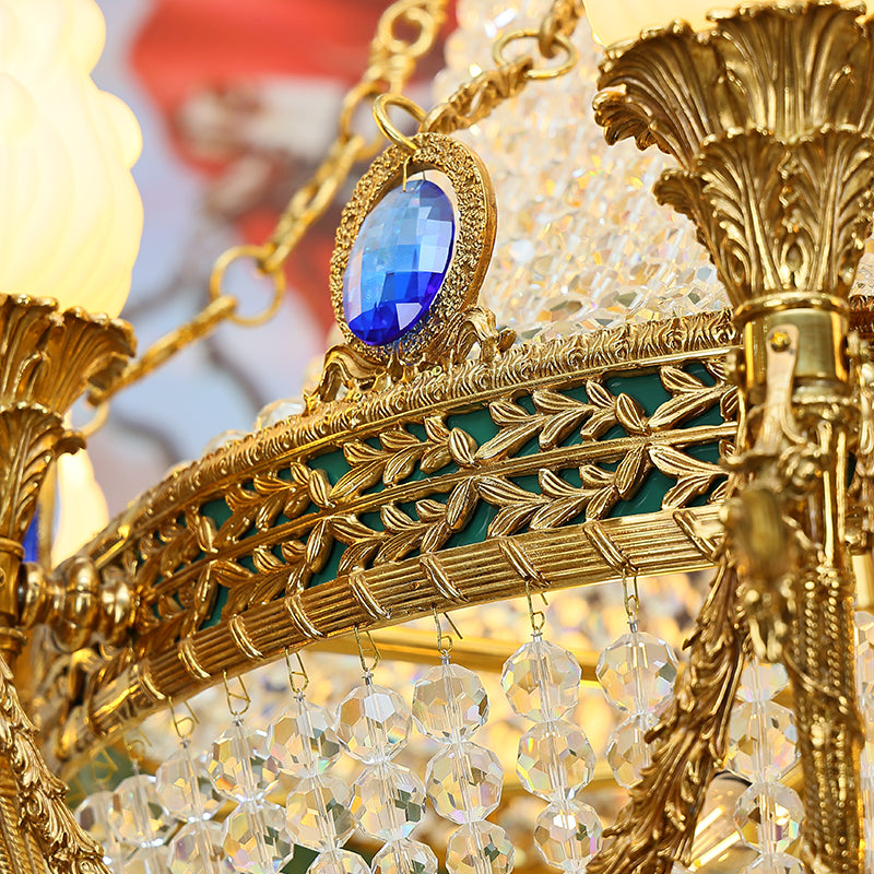Angled perspective highlighting the symmetrical arrangement of lights and the intricate brass framework.