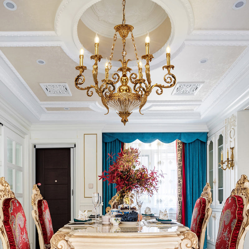 French luxury brass chandelier installed in a formal dining room with a decorative ceiling.